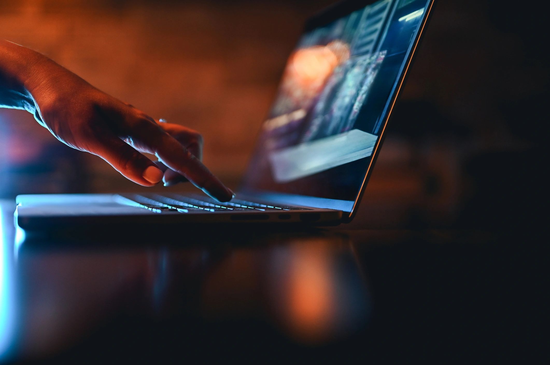 Close-up of hands typing on a keyboard