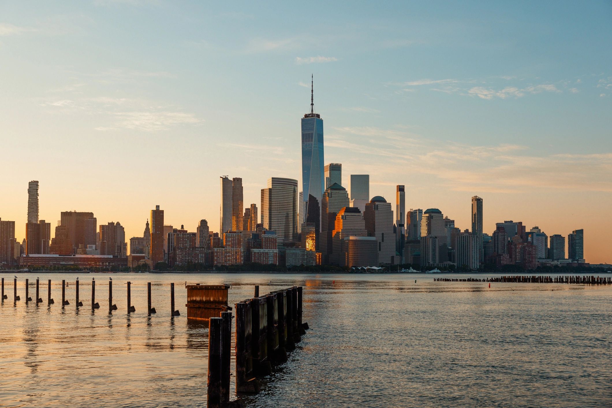 City skyline at golden hour, representing a professional insurance agency serving renters and property owners.