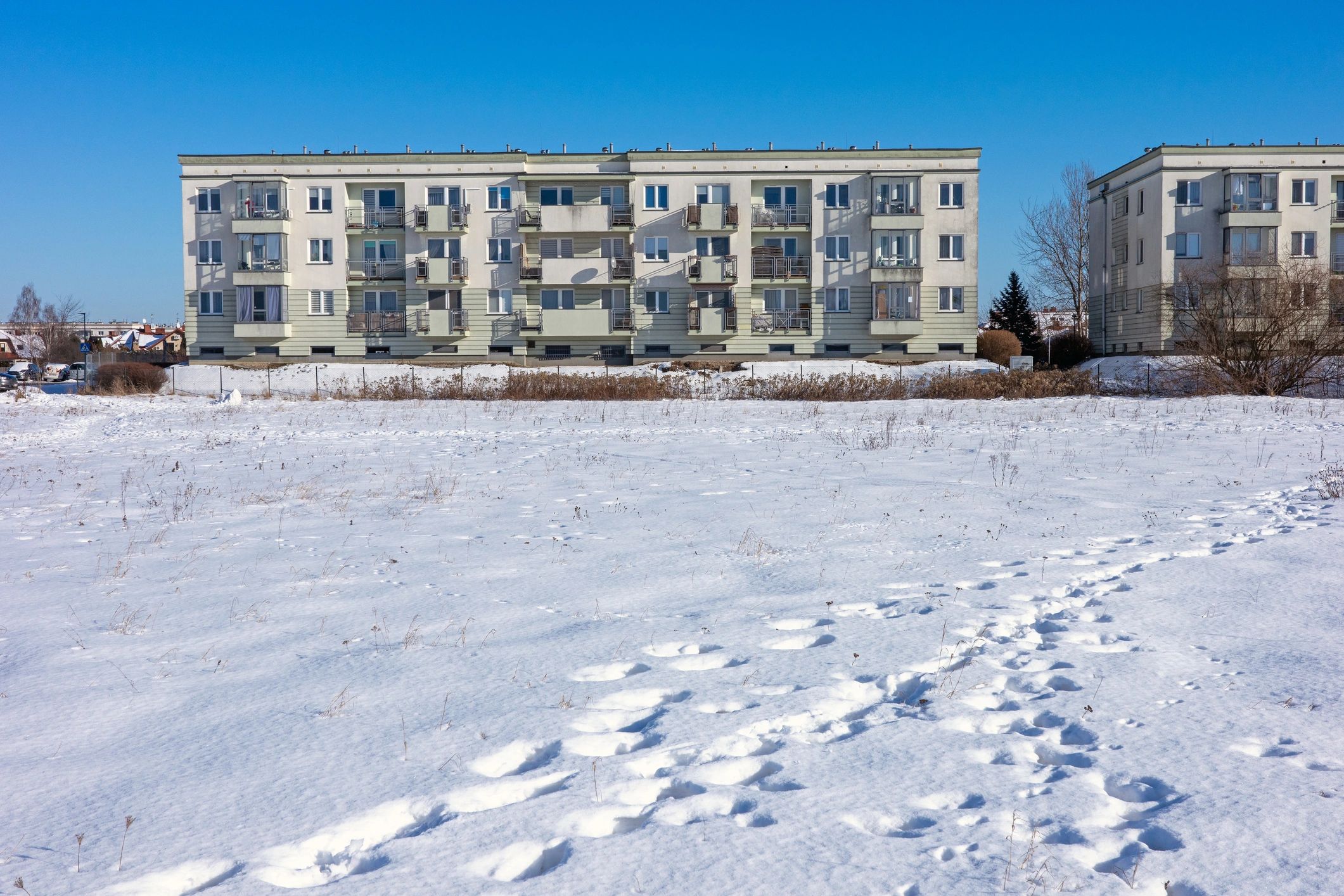 Modern multi-family apartment building exterior.